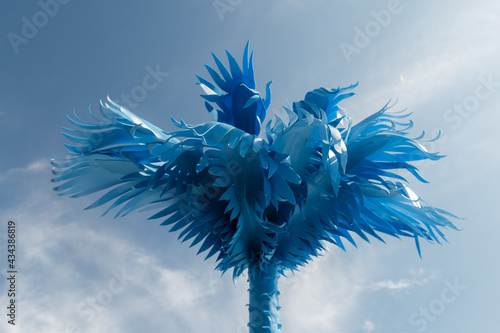 Blue palm tree against the sky. Summer scenery for the beach. Summer concept