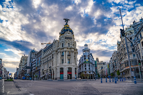 Fototapeta Naklejka Na Ścianę i Meble -  Gran Vía de Madrid from Calle Alcalá, with the Metropolis building during COVID 19
