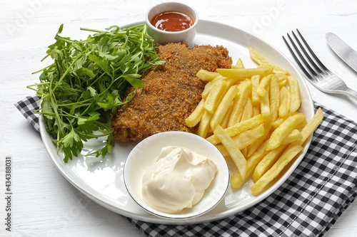 Canvas Print Homemade traditional Milanese veal escalope with french fries