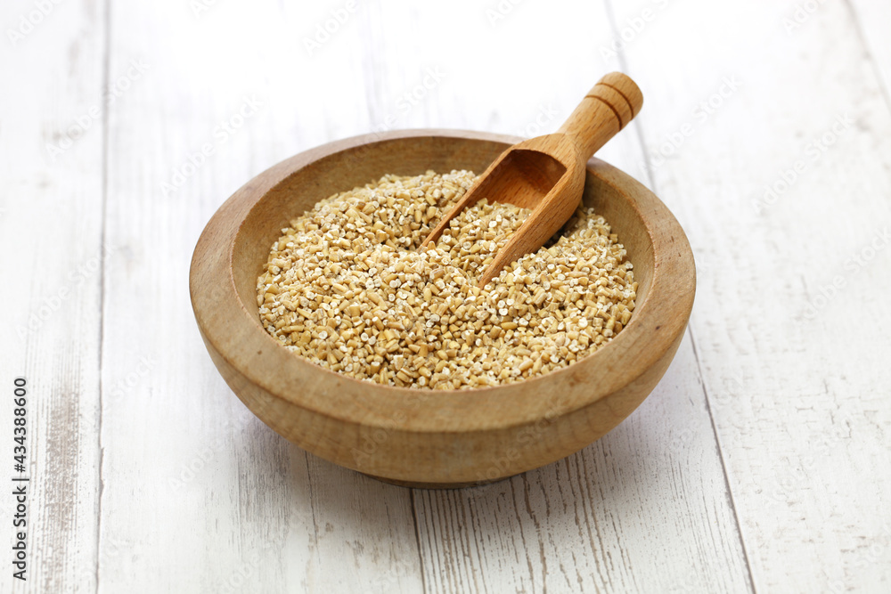 steel cut oats in wooden bowl steel cut oats in wooden bowl
