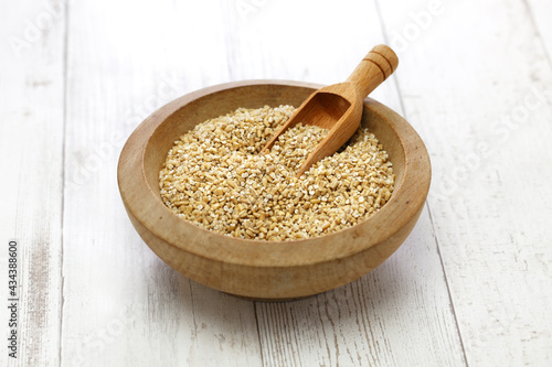 steel cut oats in wooden bowl