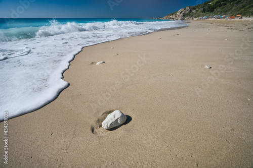 Milos beach near the Agios Nikitas village on Lefkada Ionian island, Greece. Evening sunset golden light © Igor Tichonow