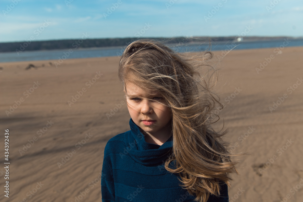 portrait of Girl in gray coat with hair on wind, close-up portrait of Girl in gray coat with hair on wind, close-up