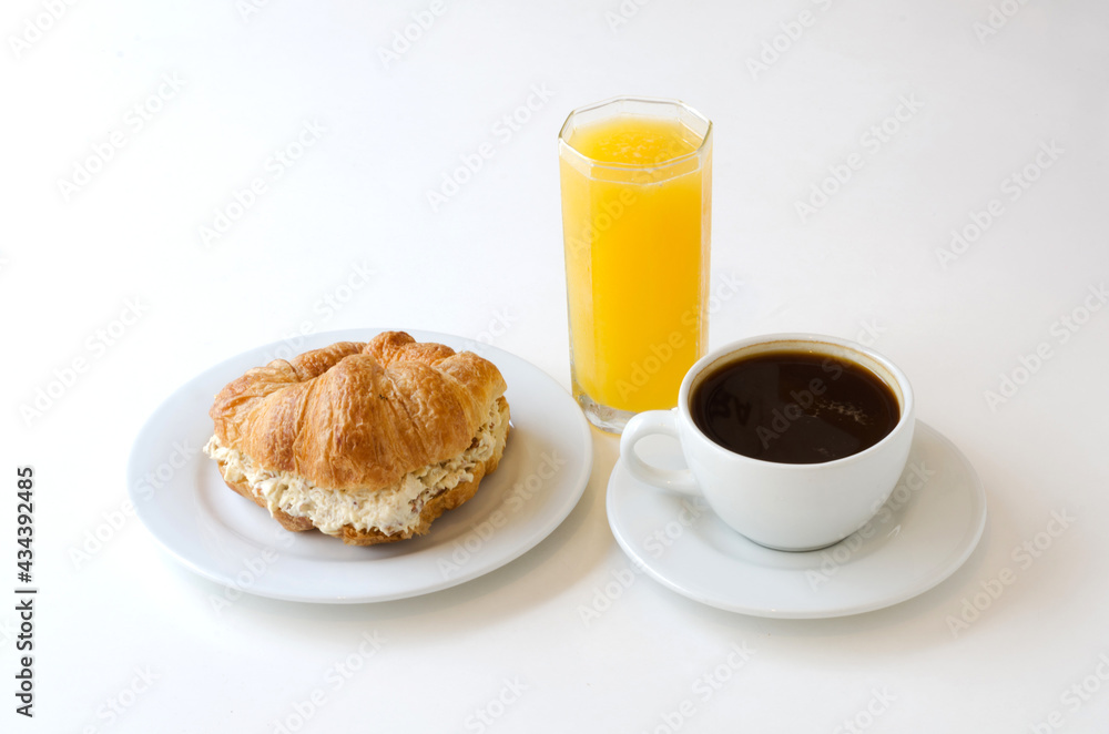 breakfast of coffee, orange juice and croissant. breakfast of coffee, orange juice and croissant.