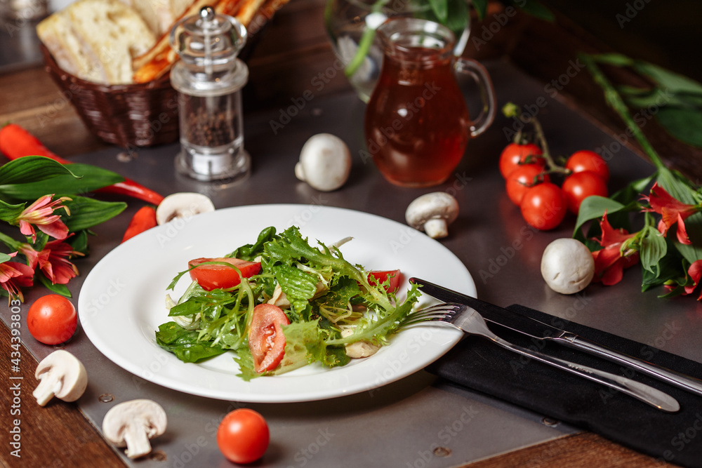 Caesar salad with chicken, cherry tomatoes, lettuce