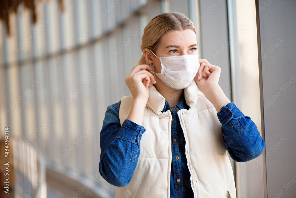 Coronavirus and Air pollution pm2.5 concept. Woman using mask for protection pm2.5 in airport terminal.Wuhan coronavirus and epidemic virus symptoms Coronavirus and Air pollution pm2.5 concept. Woman using mask for protection pm2.5 in airport terminal.Wuhan coronavirus and epidemic virus symptoms