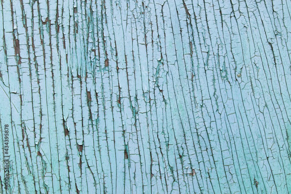 Fototapeta premium Cracked wooden surface on the wall, blue abstract backdrop with vintage effects.