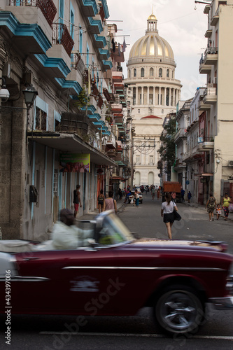 Photography Amazing old american car on streets of Havana with Capitolio Building in background during the day