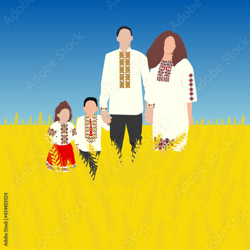 happy family in wheat field. Happy ukrainian family with little son and daughter in traditional ukrainian dress