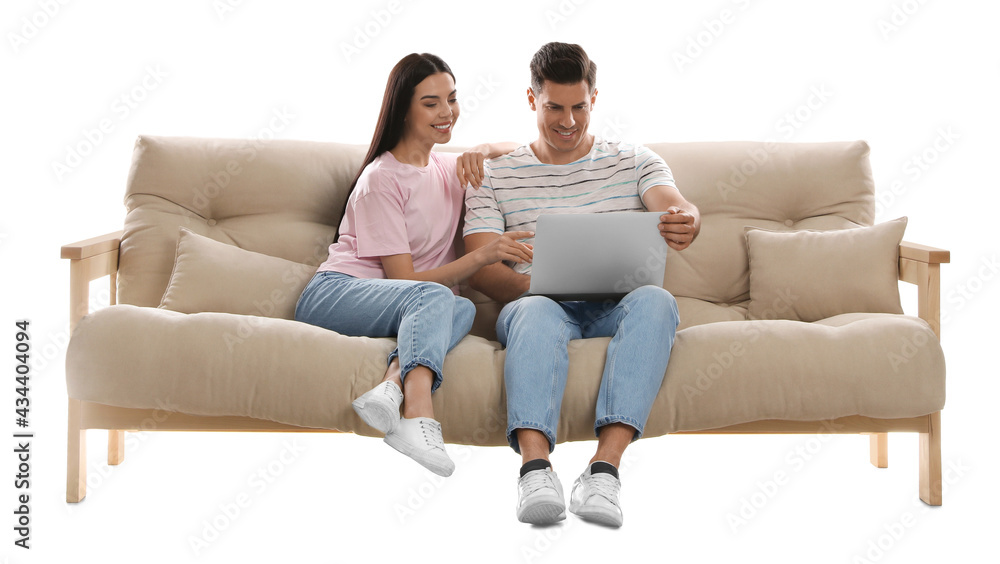 Happy couple with laptop on comfortable sofa against white background Happy couple with laptop on comfortable sofa against white background