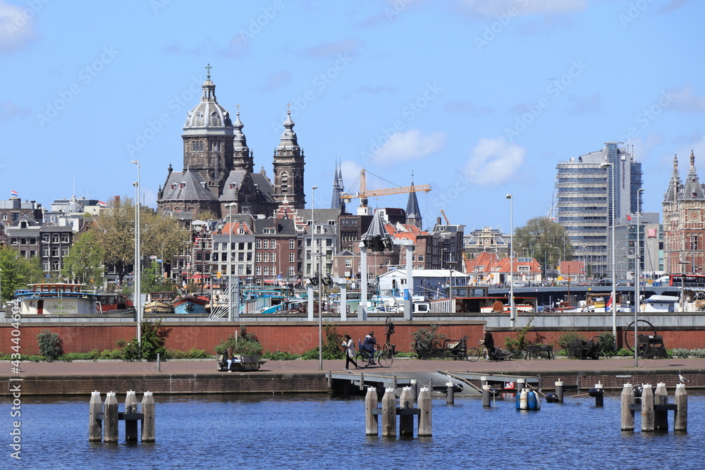 Amsterdam Oosterdok View with People, Buildings and St Nicholas Basilica