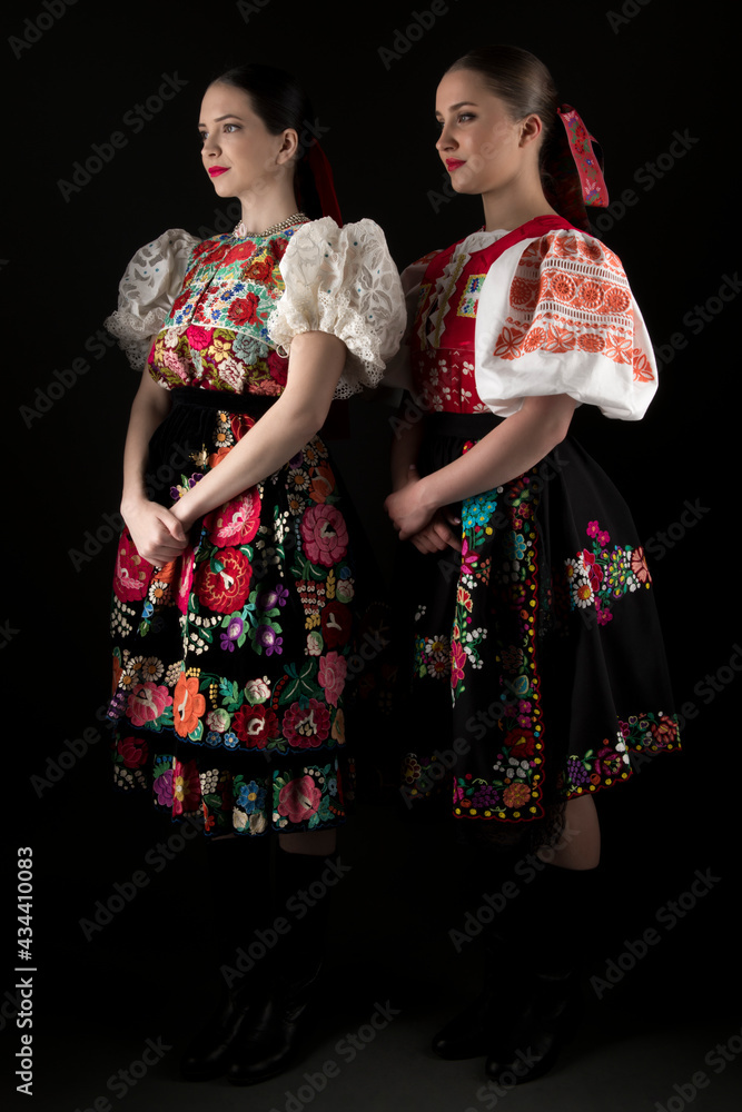Obraz premium Young beautiful slovak woman in traditional dress. Slovak folklore 