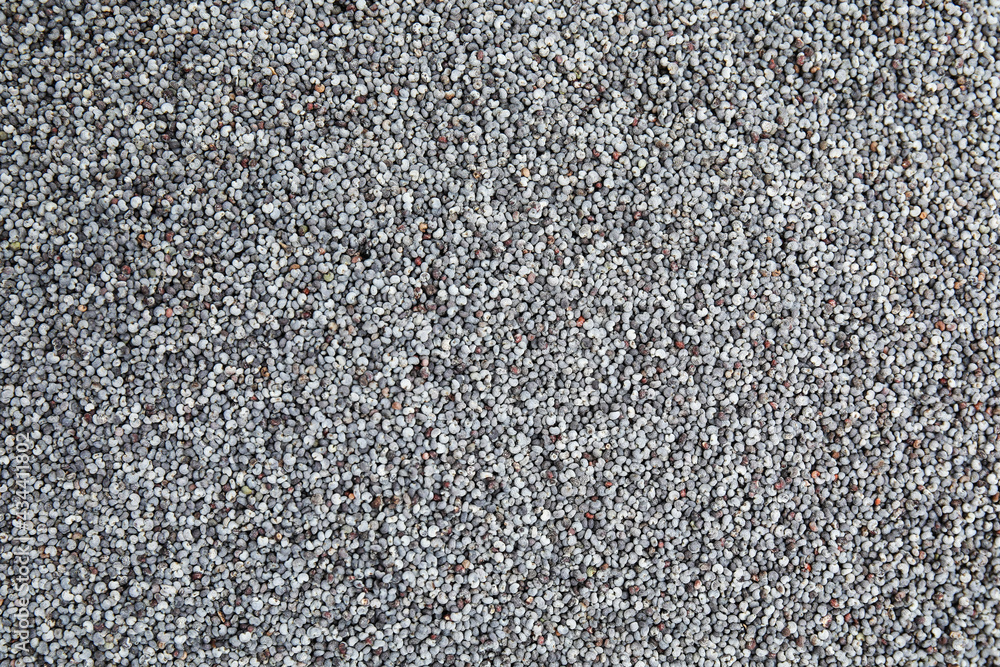 Heap of poppy seeds as background, top view. Veggie food Heap of poppy seeds as background, top view. Veggie food