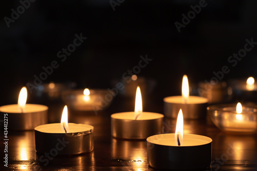 many small candles in the dark