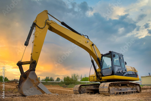 Excavator. A machine for earthworks. Construction site. Excavator for construction work