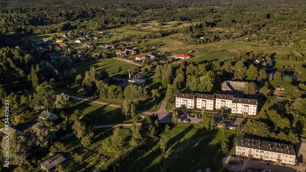 Naklejka premium Aerial view of Mezvalde village in sunny summer evening, Latvia.