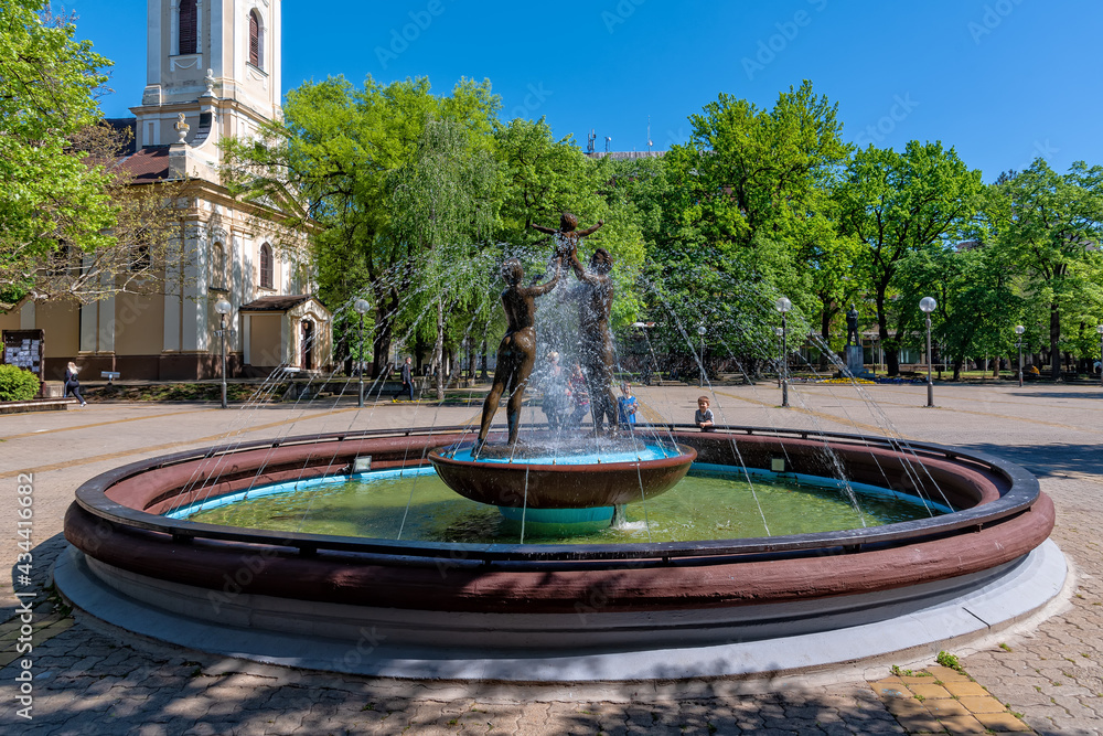 Kikinda, Serbia - July 26, 2019: National Museum building and beautiful fountain with sculpture 