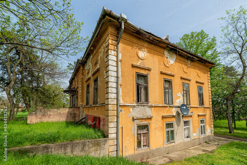 Novi Becej, Serbia - May 01, 2021: Castle on Biserno Ostrvo (Pearl Island) in the natural surroundings og a branch of the river, socalled dead Tisa river. Novi Becej, Serbia - May 01, 2021: Castle on Biserno Ostrvo (Pearl Island) in the natural surroundings og a branch of the river, socalled dead Tisa river.