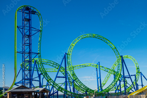 blue green rollercoaster tracks fair ride photo