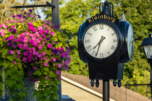 Antique vintage outdoor clock in the village of Kleinberg Ontario. photo