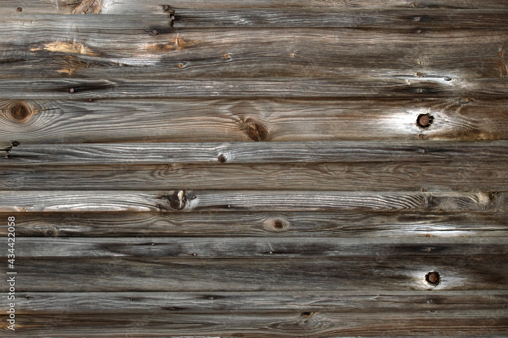 Fototapeta premium Wooden background from old boards with knots and nails