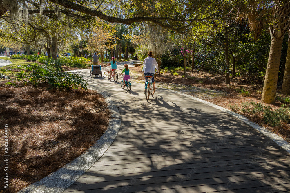 A young family cyling on a pathway on Hilton Head Island.