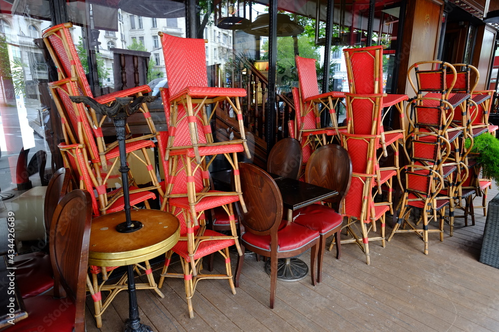 Some chairs stacked at a Parisian restaurant the 18th May 2021. One day before the reopening of all the terraces in France. Boulevard des Italiens, Paris, France.