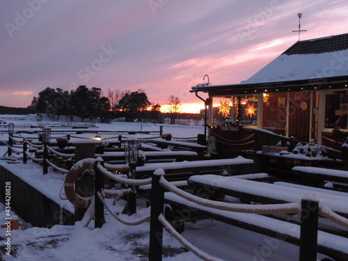 sunset on the pier snowing