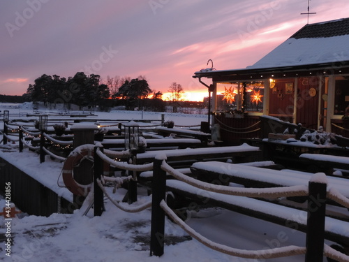 sunset on the pier snowing