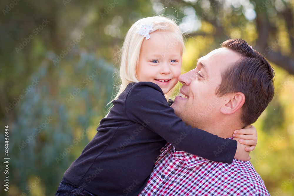 Young Caucasian Father and Daughter Having Fun At The Park Young Caucasian Father and Daughter Having Fun At The Park