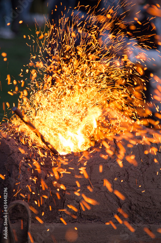 Forging outdoors and sparkles around macro 