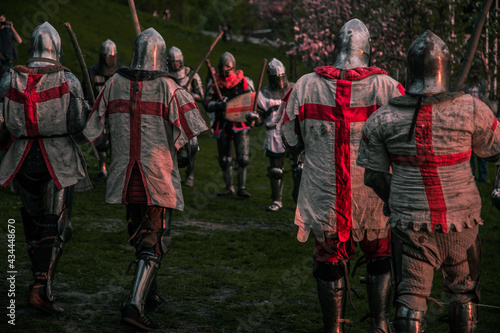 Knights fighting at sunset outdoors