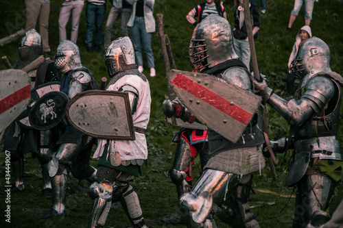 Knights fighting at sunset outdoors