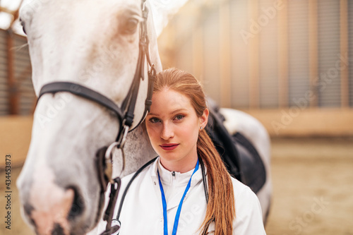 Veterinarian examining horses at the ranch.