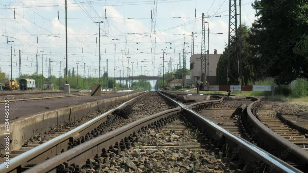 Railway track in the distance, with train station and busy road Railway track in the distance, with train station and busy road