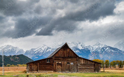 historic Moulton barns n Mormons' Row against the dramatic Teton mountain range in Wyoming.