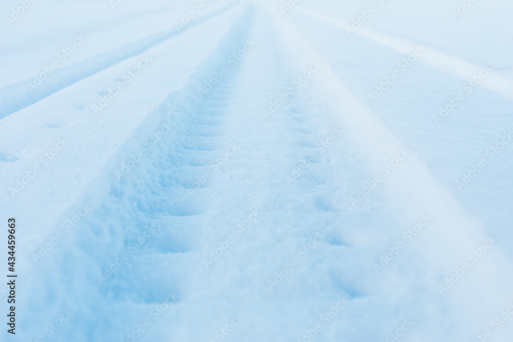 snow track imprint of snowmobile, close-up view snow track imprint of snowmobile, close-up view
