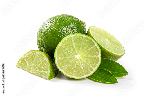 Fresh lime with cut in half and leaves isolated on white background.