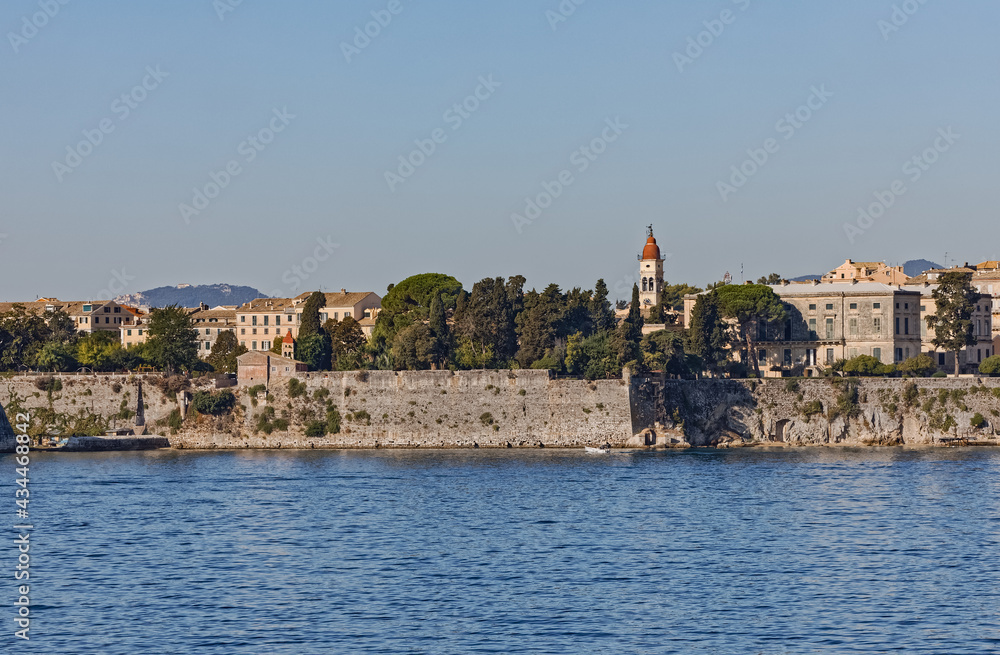 Waterfront promenade by Venetian fortress in Corfu town Greece Waterfront promenade by Venetian fortress in Corfu town Greece