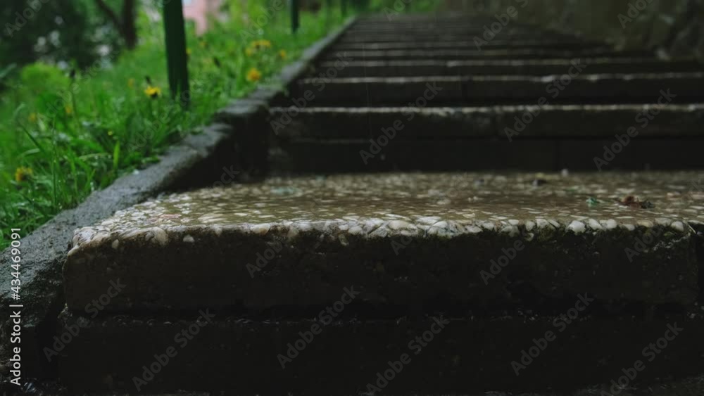 Water Flowing Down Concrete Flatstone Stairs During Rain Water Flowing Down Concrete Flatstone Stairs During Rain