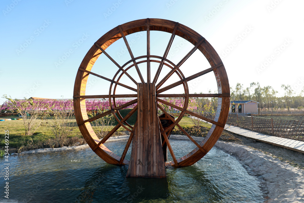 Wooden waterwheel architecture landscape in the park Wooden waterwheel architecture landscape in the park