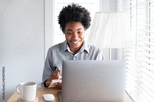 Woman having an online class meeting through e-learning system