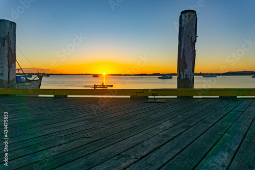 Fototapeta Naklejka Na Ścianę i Meble -  Into the sunrise at Tauranga waterfront