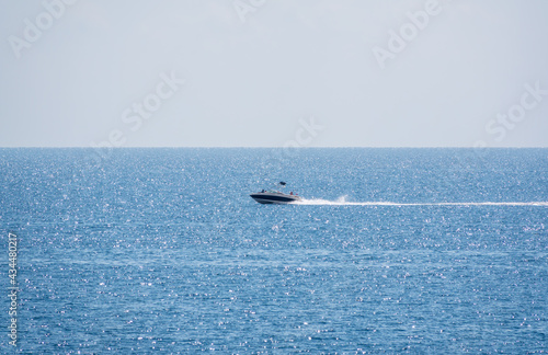 Motor boat in the blue calm sea.
