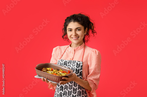 Young woman with baking dis...