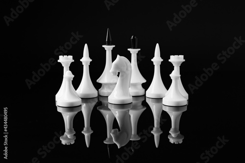 Chess pieces on dark background photo