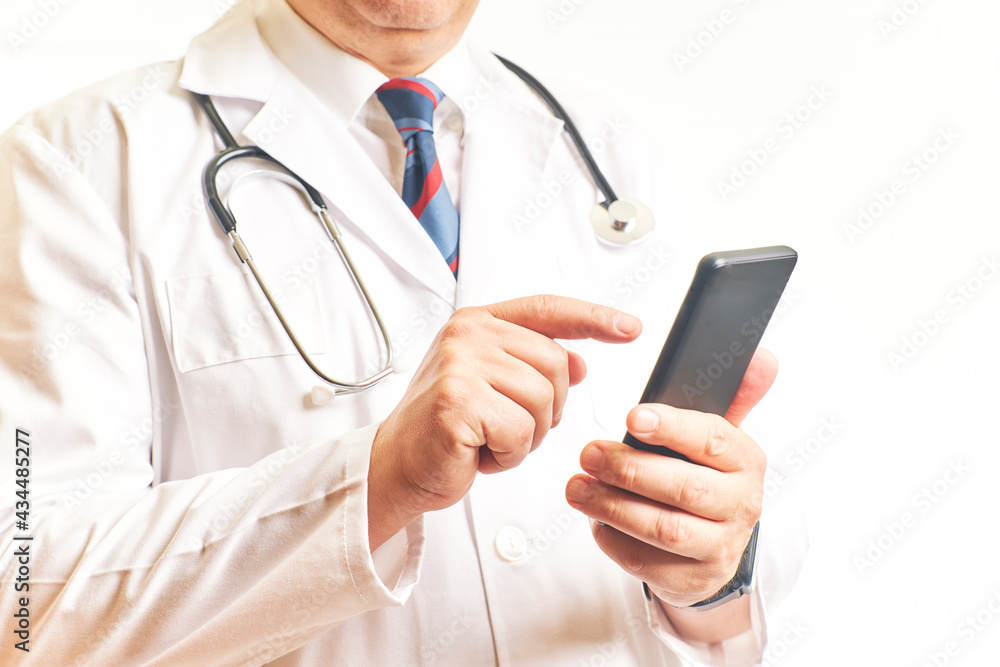 Doctor consulting cell phone to view patient data. Health concept Doctor consulting cell phone to view patient data. Health concept