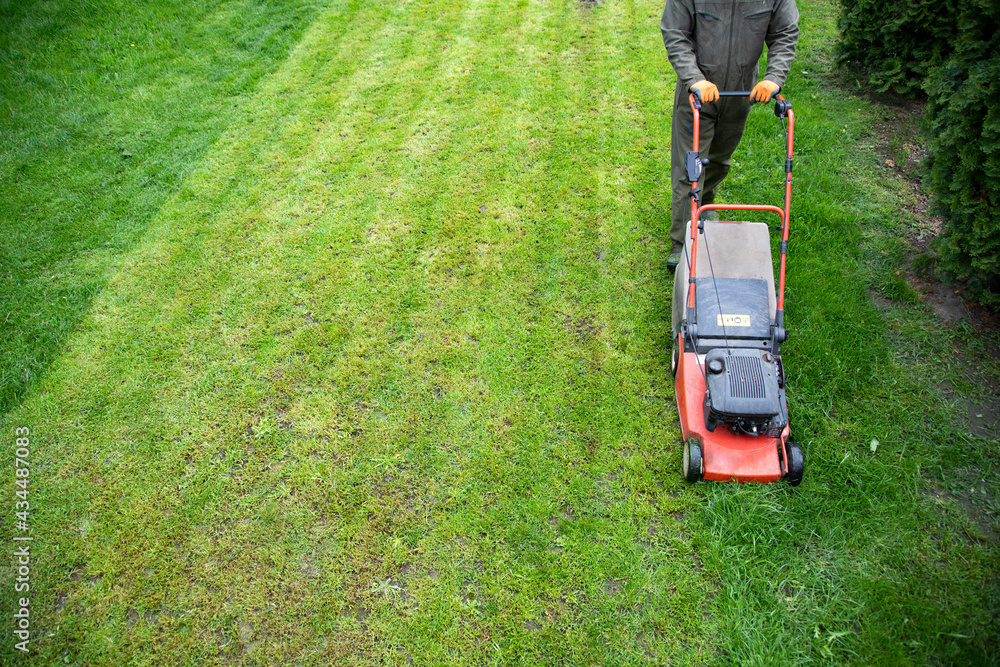 Lawn mover on green grass. Machine for cutting lawns. Lawn mover on green grass. Machine for cutting lawns.