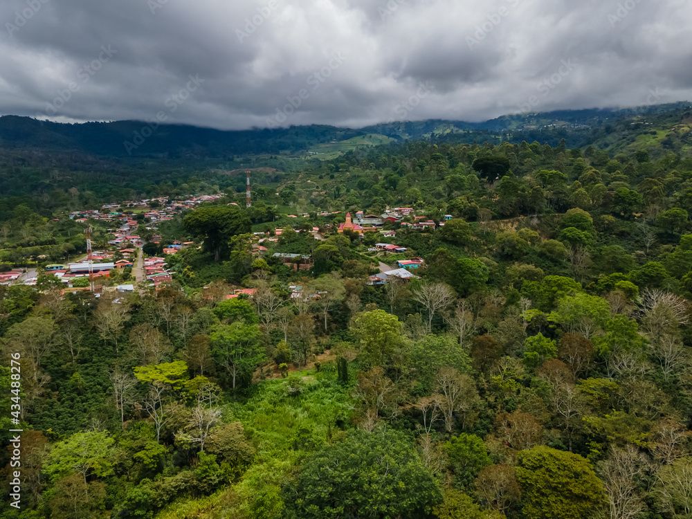 Obraz premium Beautiful aerial view of the Aquiares town and its iconic yellow church in Cartago Costa Rica