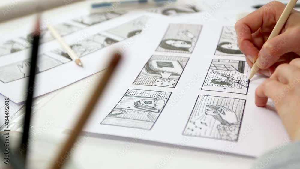 A designer draws a storyboard for an animated film comic strip. Scene sketches for the cartoon. 4K. A designer draws a storyboard for an animated film comic strip. Scene sketches for the cartoon. 4K.